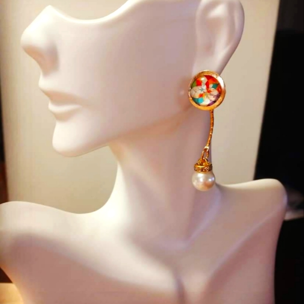 Handmade gold plated stainless steel earrings with dangling pearls.